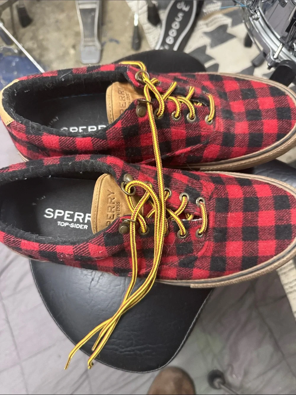 Sperry Red and Black Plaid Boat Shoes with Yellow Laces.